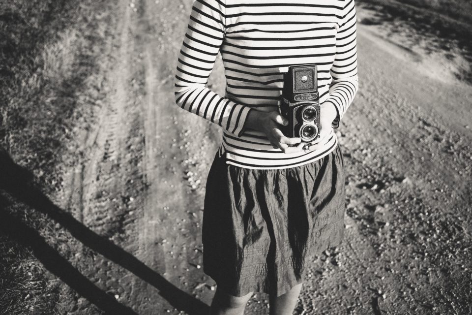 Girl with a medium format film camera