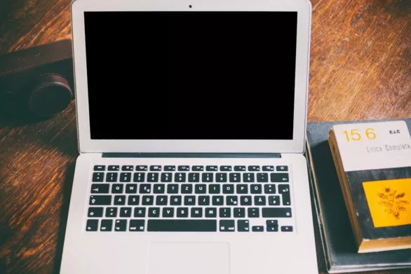 MacBook Air, camera and books