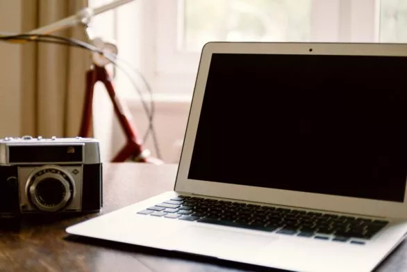 MacBook Air and vintage camera