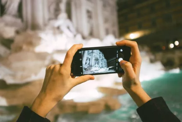 Taking a photo of Trevi Fountain