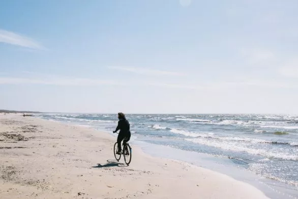 Girl, bike and sea