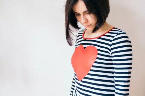 Girl with a heart on her shirt