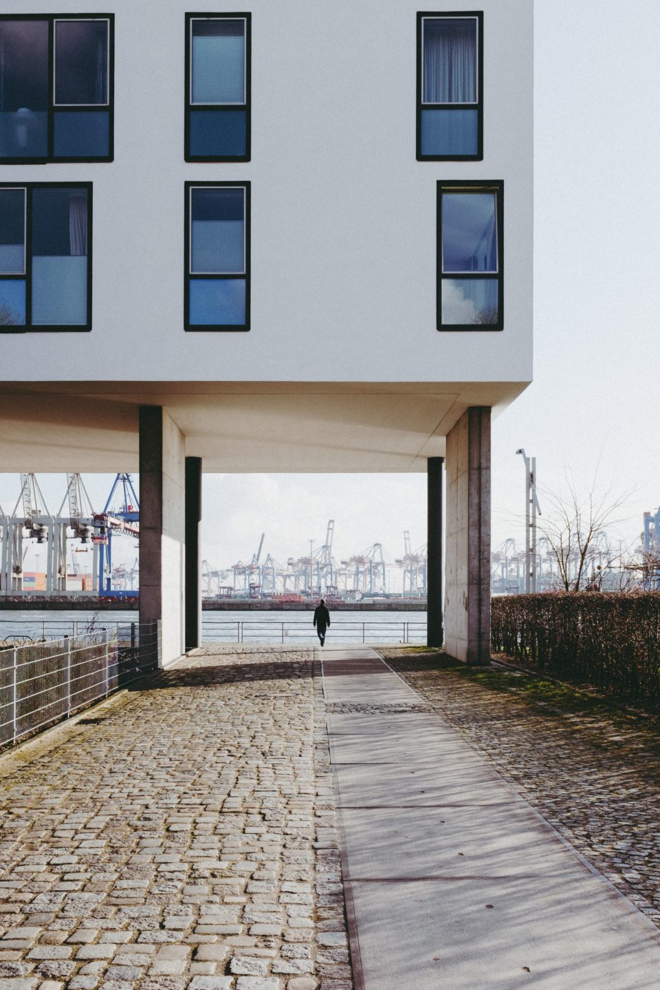 Man walking in front of the port of Hamburg
