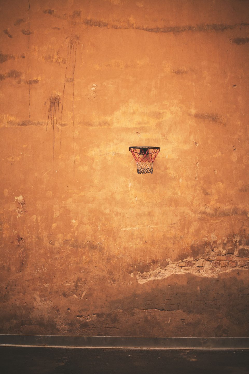 Old wall with basketball ring vertical