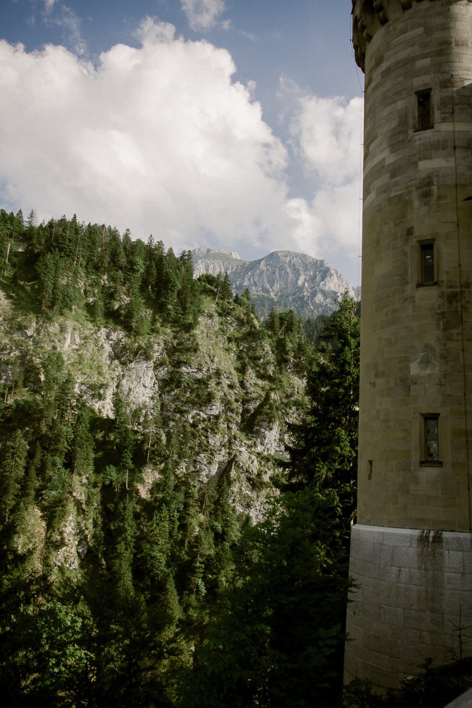 Bavarian landscape and a tower of castle Neuschwanstein