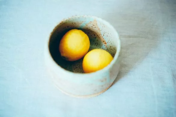 Two lemons in a bowl