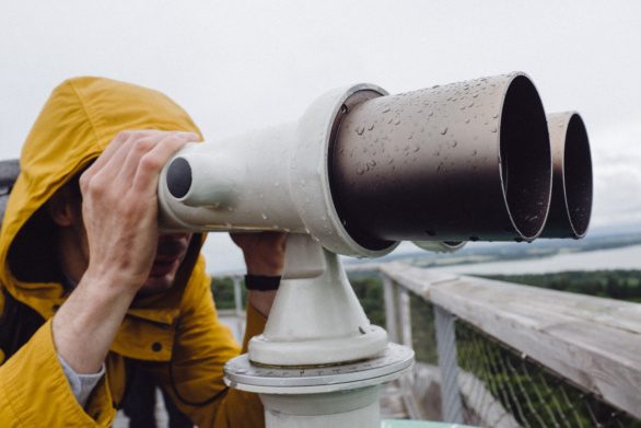 Guy with touristic binoculars