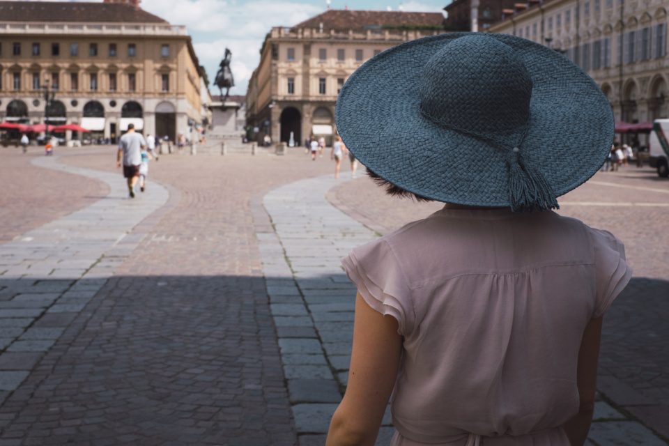 Girl in blue hat on Piazza San Carlo royal square in Turin (Tori