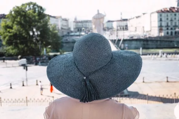 Girl in blue hat on Piazza Gran Madre di Dio in Turin Italy