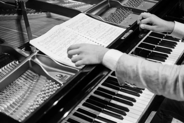 Hands of a pianist in black and white