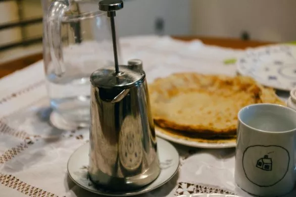 coffee pot and breakfast on the table