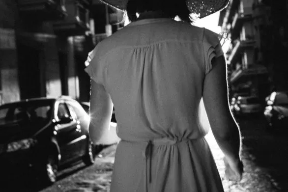 Walking girl from the back in black and white