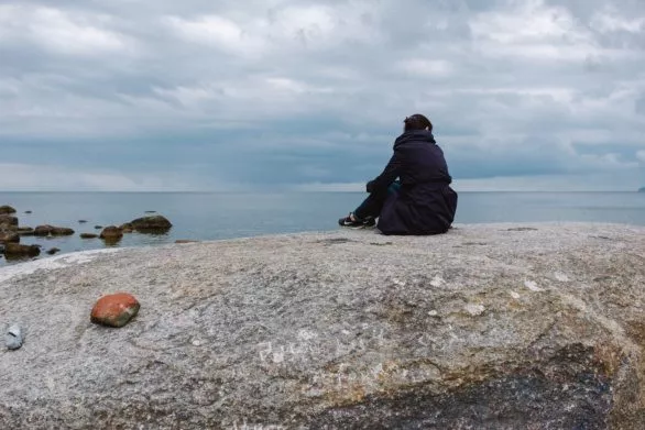 girl on a rock near the sea