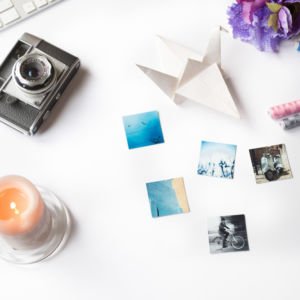 Styled photo with camera and candle