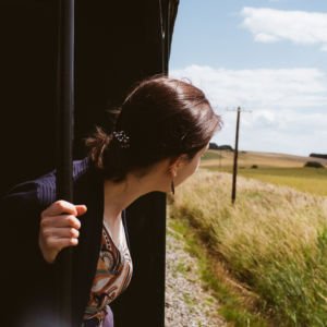 girl leaning from the train