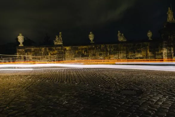 Abstract headlight lines in a medieval city