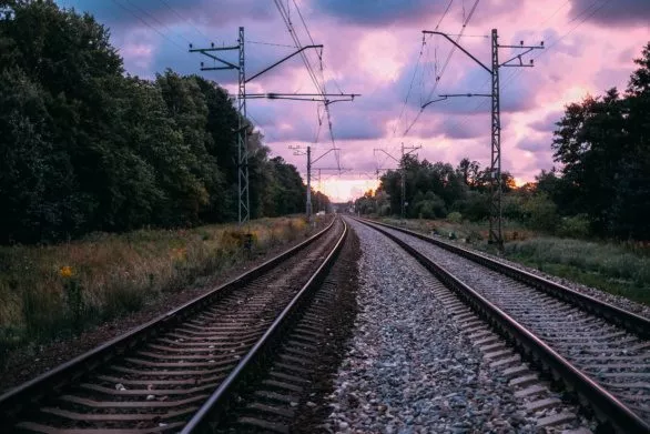 the railroad tracks and the sunset sky