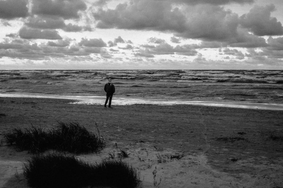 A lonely figure on the stormy seashore