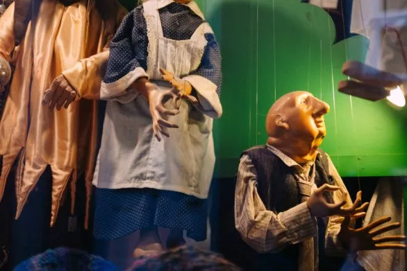 puppets in the storefront window