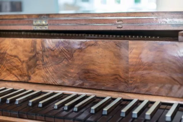 A vintage keyboard musical instrument