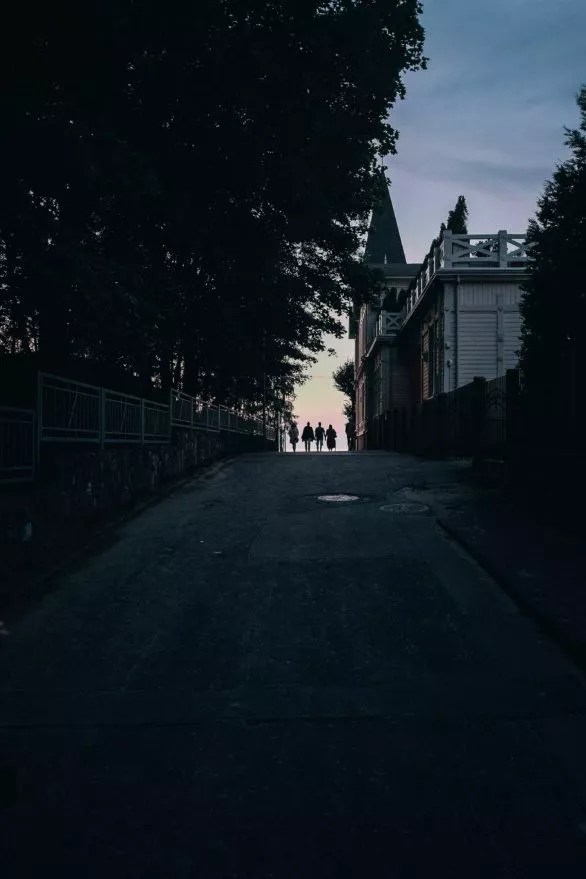 People walking towards sunset