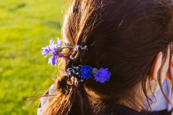 Field flowers in a young woman's hair