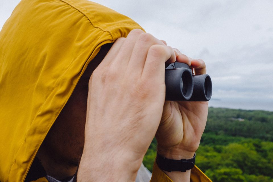 Guy with small binoculars