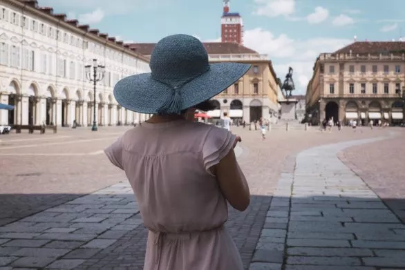Young woman in blue hat in Turin Italy