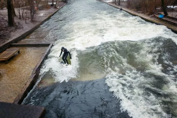 Surfing the Eisbach river in Munich