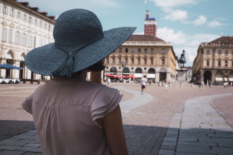 Young woman in blue hat in Turin Italy