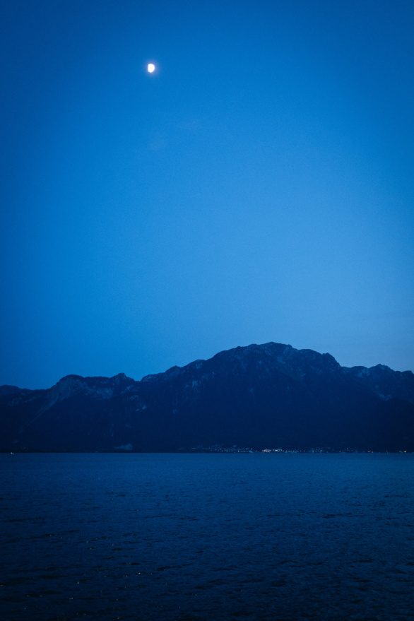 The moon over the night lake of Geneva