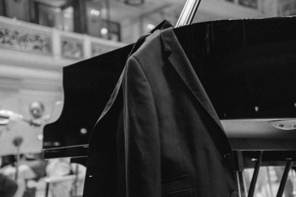 Pianist tailcoat on the piano