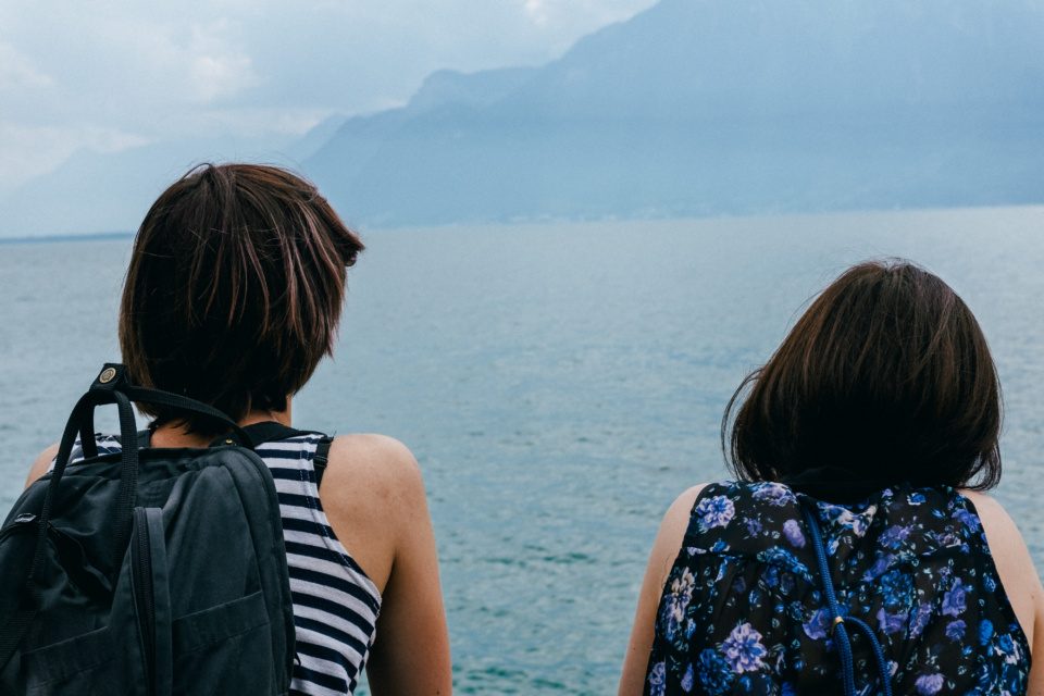 Two young women admiring Lake Geneva