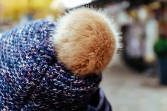 Fluffy pompon on a knitted hat
