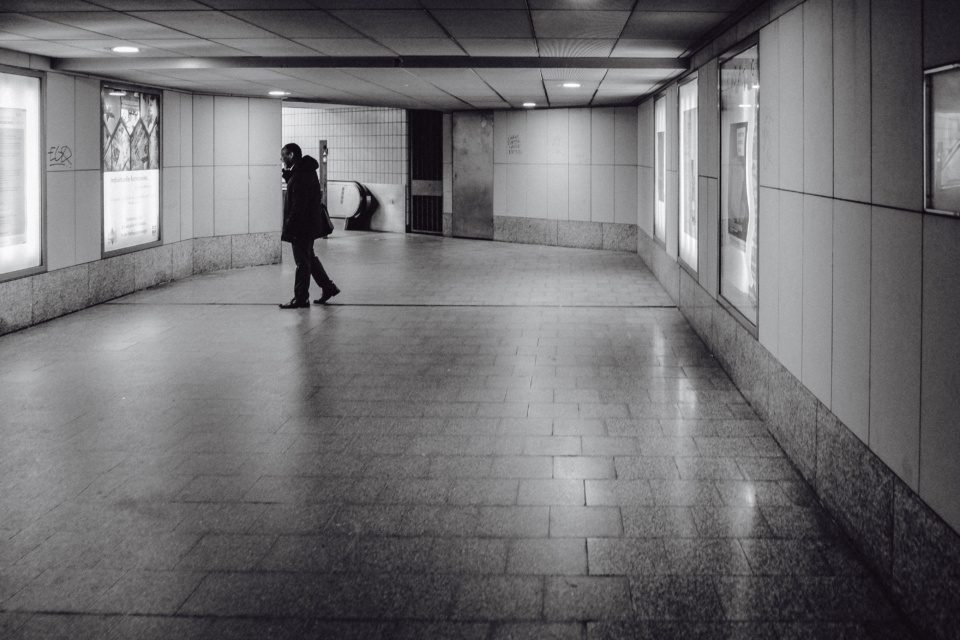 A man at a subway crossing