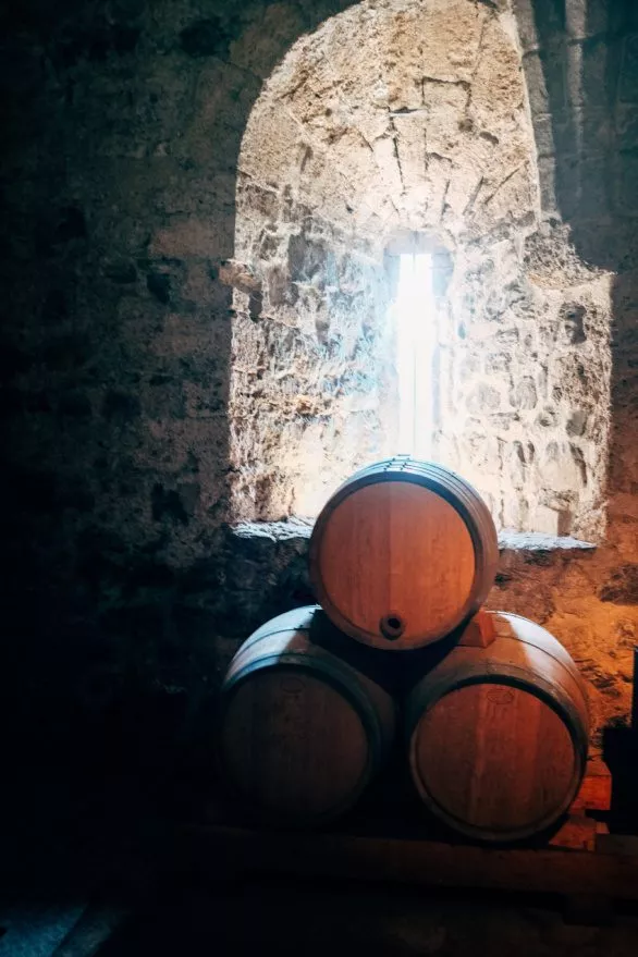 Wine barrels in the medieval cellar