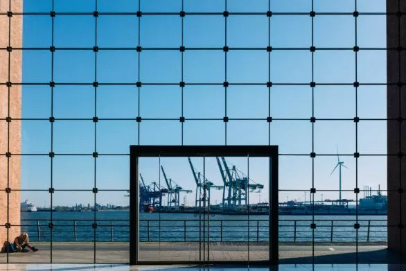 Hamburg port through the glass wall of an office building