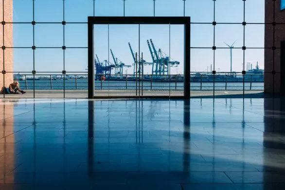Hamburg port through the office building glass wall