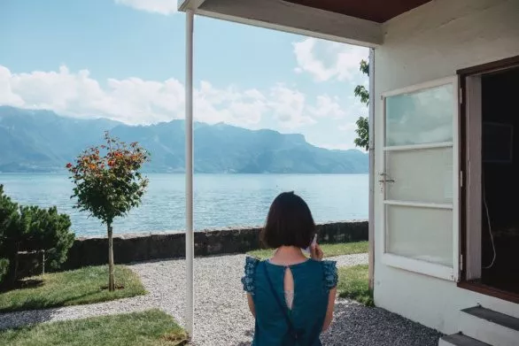 Young woman in the yard of Villa Le Lac in Vevey