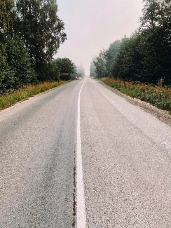 Empty asphalt road in mist