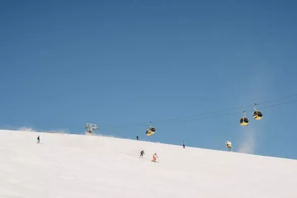 Skiers on slope in ski resort