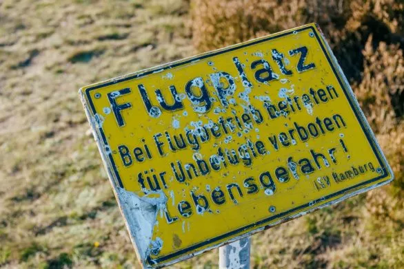Old warning sign at abandoned airfield