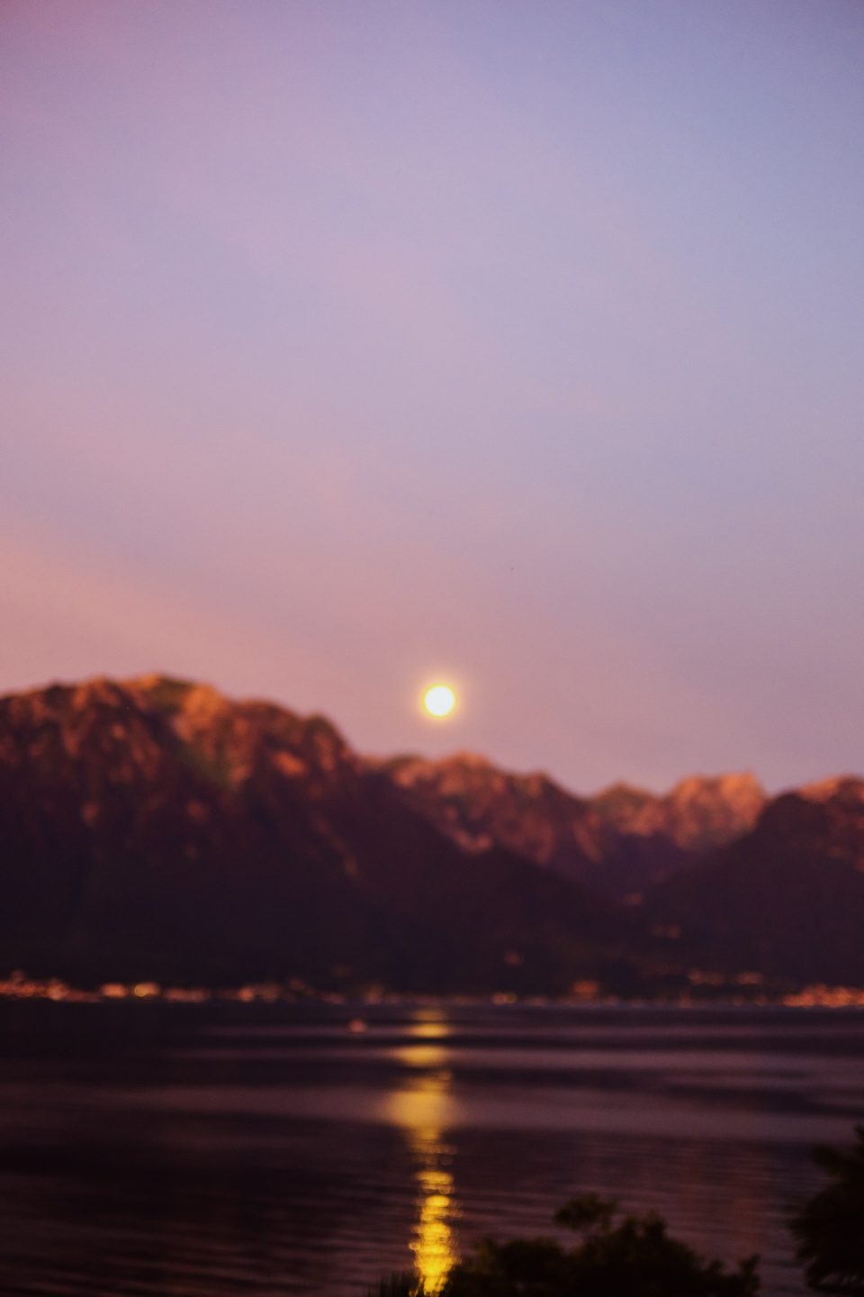 Moon, mountains, and lake blurred