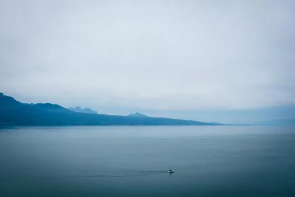 A boat on Lake Geneva on a cloudy day
