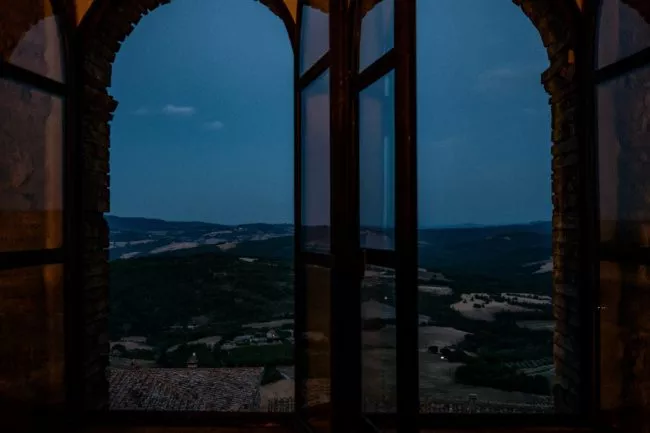 Tuscan landscape at dusk in the window