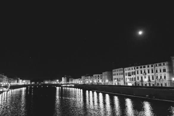 The Arno River at Night in Pisa, Italy