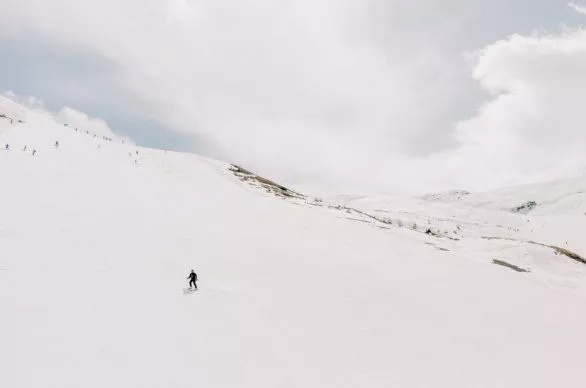 Skiers on ski track in Livigno, Italy