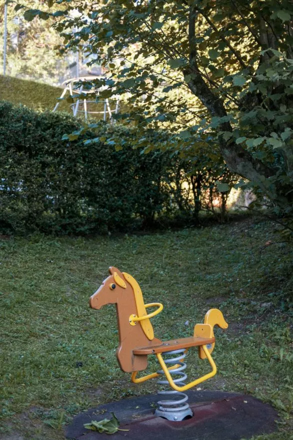 Horse-shaped swing awaits children on a playground