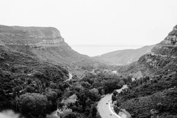 Monochrome Montserrat Gorge Road with Cars in Motion