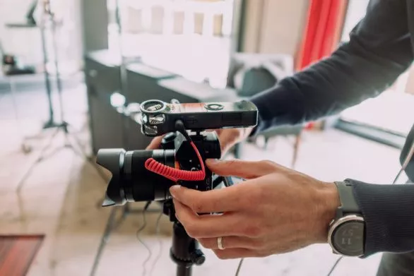 Videographer sets up a camera
